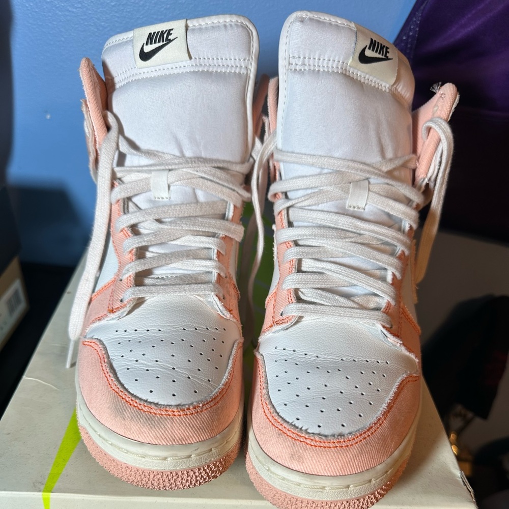 Woman’s high top Nike shoes